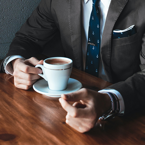 a businessman holding coffee
